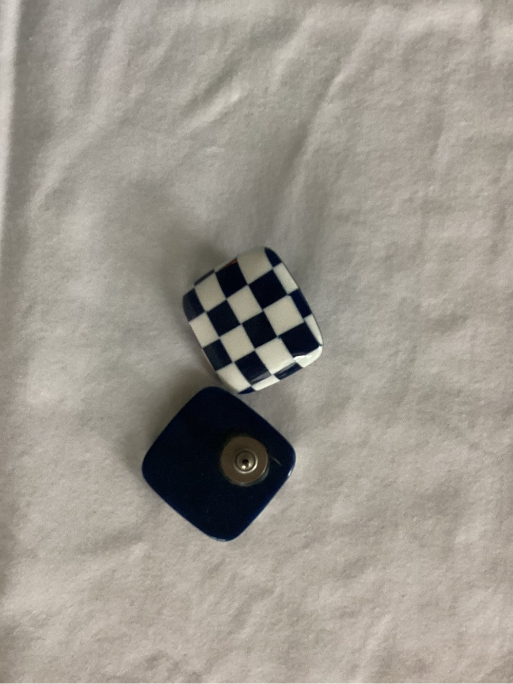 Women’s navy and white checkered earrings